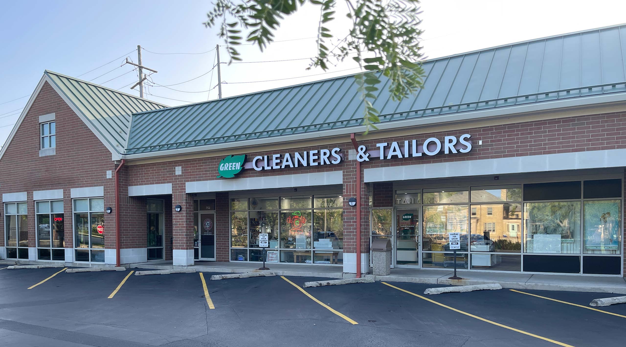 Green Cleaners storefront and garment care banner