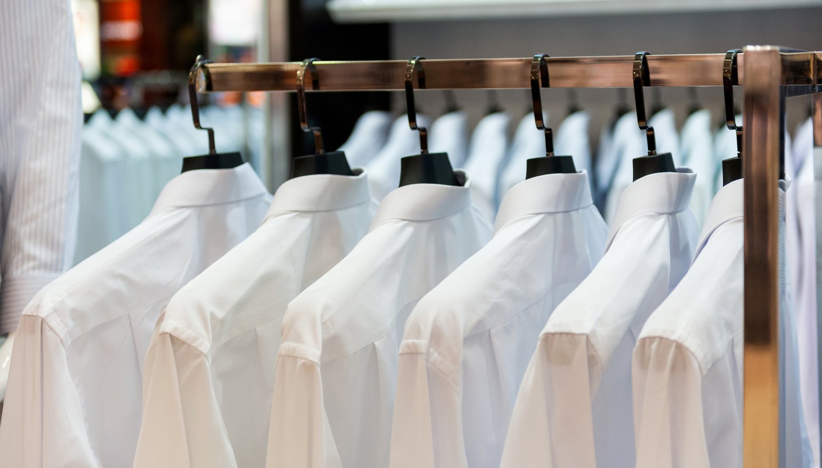 Fresh white shirts hanging neatly